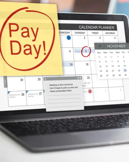 laptop screen showing a calendar with a sticky note marked 