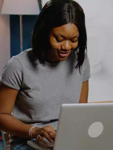 a young woman using a laptop, featured in a listicle format article.